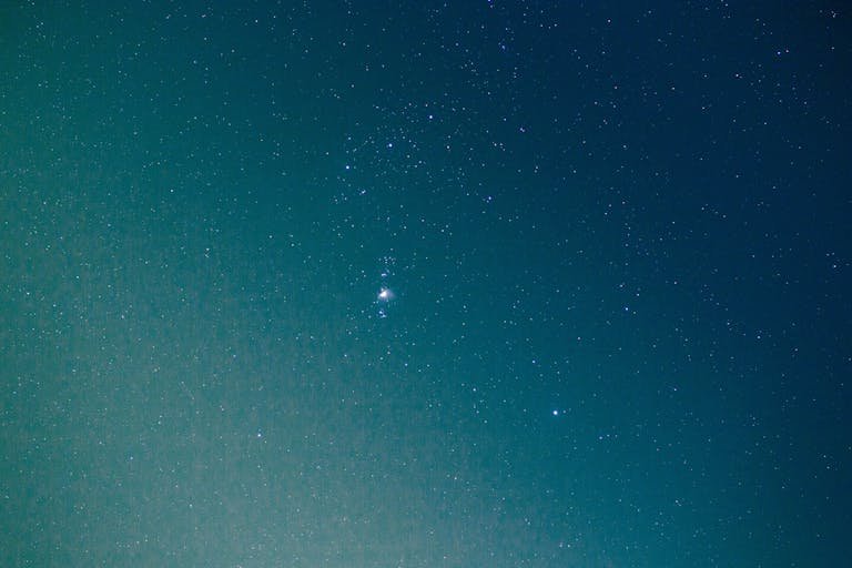 A stunning view of the Orion constellation amidst a starry night sky.