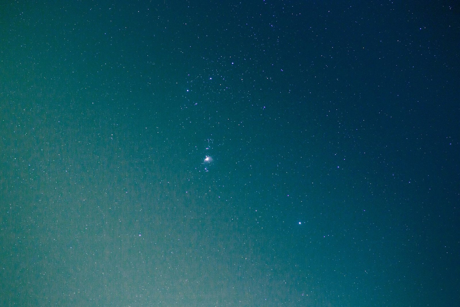 A stunning view of the Orion constellation amidst a starry night sky.