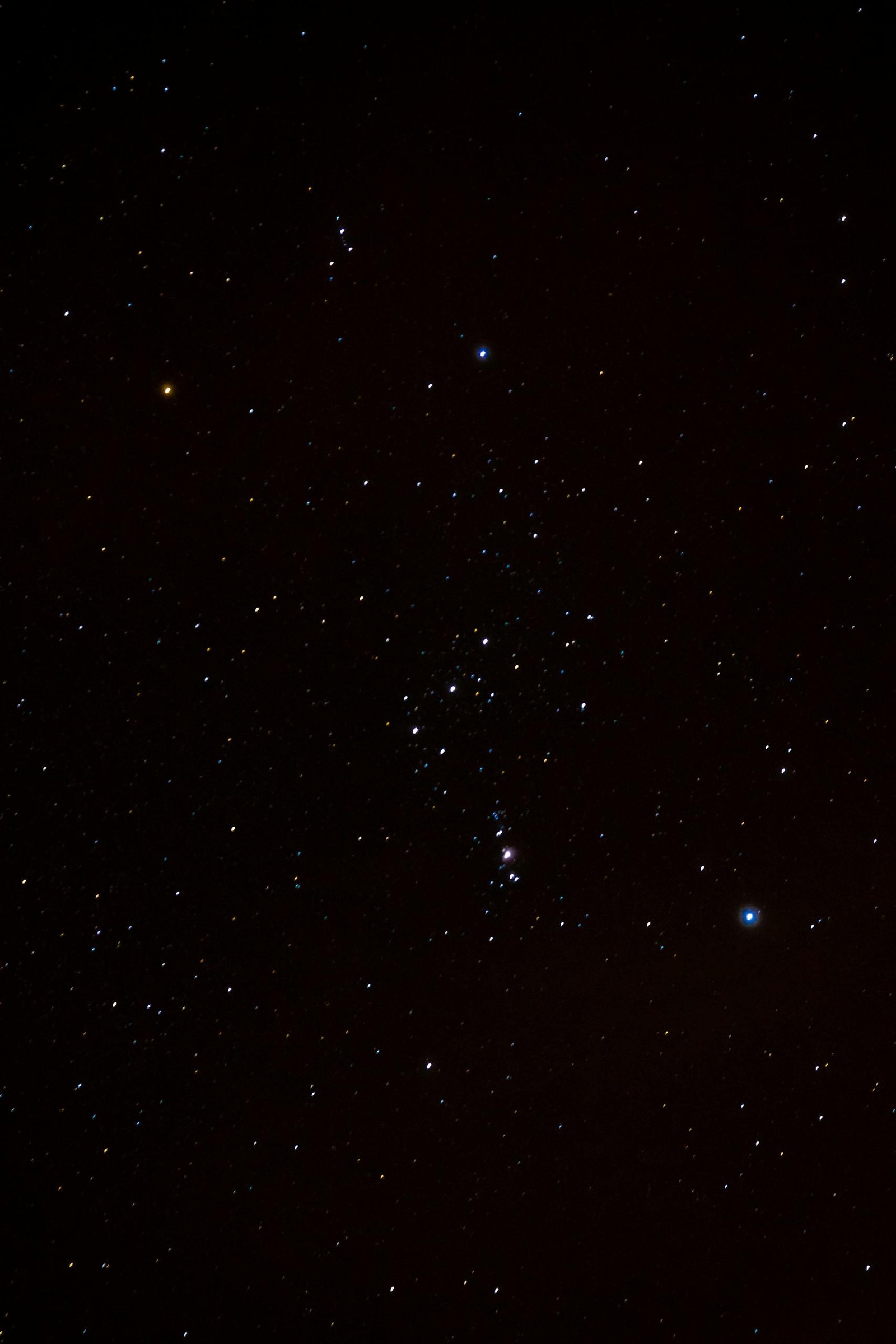 Beautiful night sky featuring the Orion constellation and numerous stars.