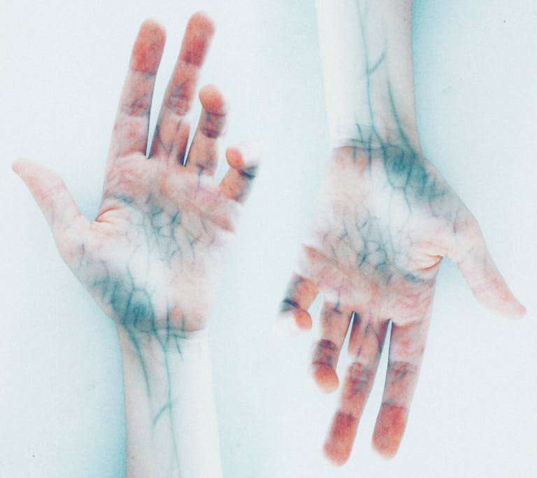 Creative depiction of vibrant human hands with detailed veins in a surreal style.