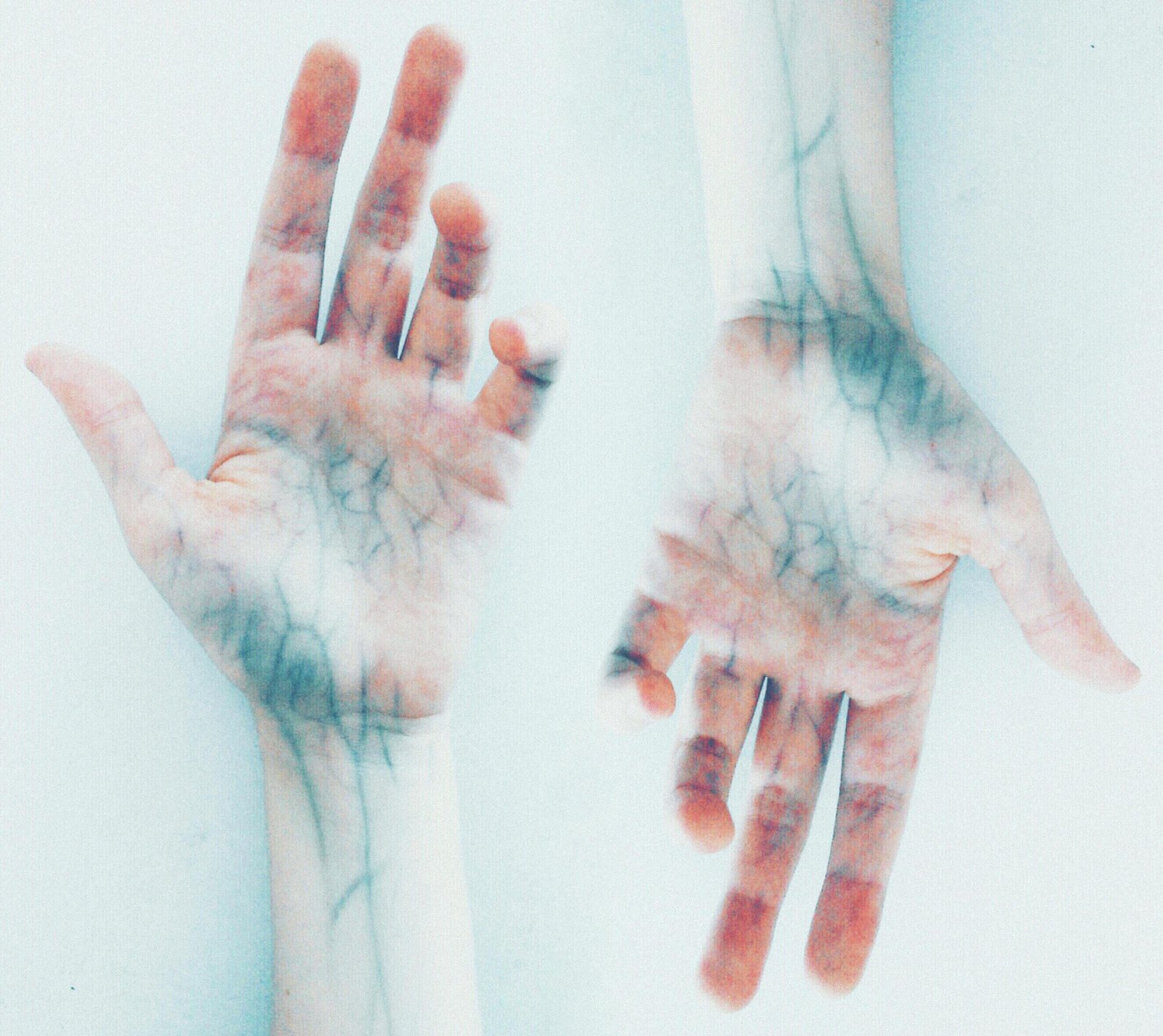 Creative depiction of vibrant human hands with detailed veins in a surreal style.
